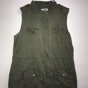 A dark green no sleeve jacket